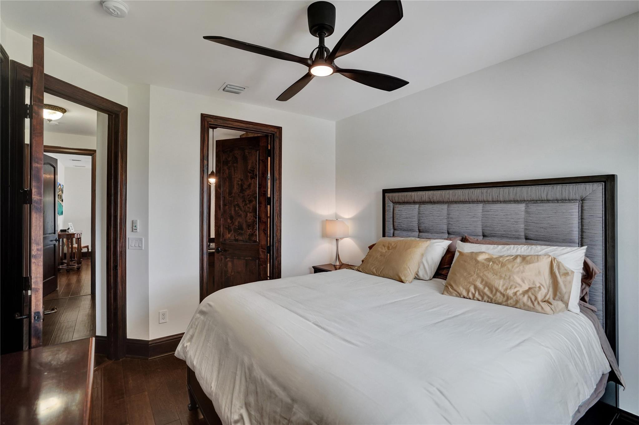 4930 Northeast 27th Terrace Lighthouse Point, FL 33064 - Photo 31 of 51 a bedroom with a bed and a chandelier