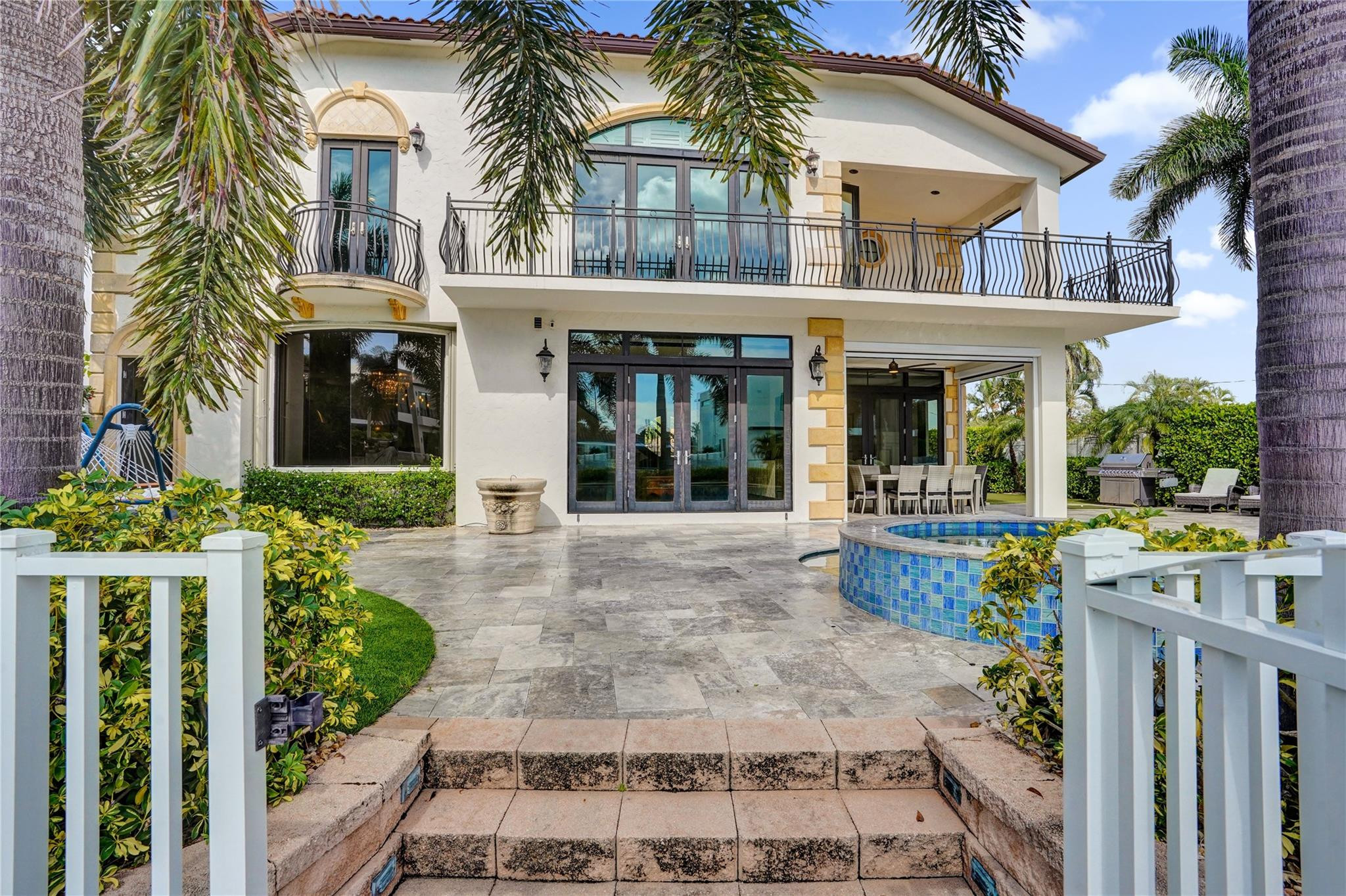 4930 Northeast 27th Terrace Lighthouse Point, FL 33064 - Photo 33 of 51 front view of a house with a porch