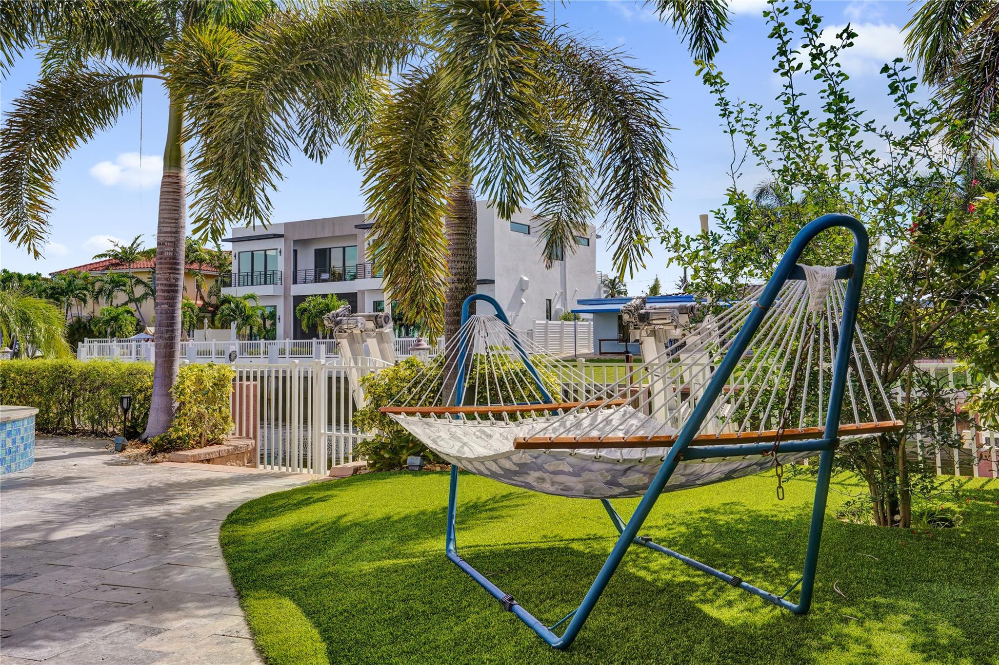4930 Northeast 27th Terrace Lighthouse Point, FL 33064 - Photo 42 of 51 a view of a house with backyard water slide and sitting area