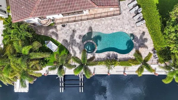 a view of a swimming pool with a patio