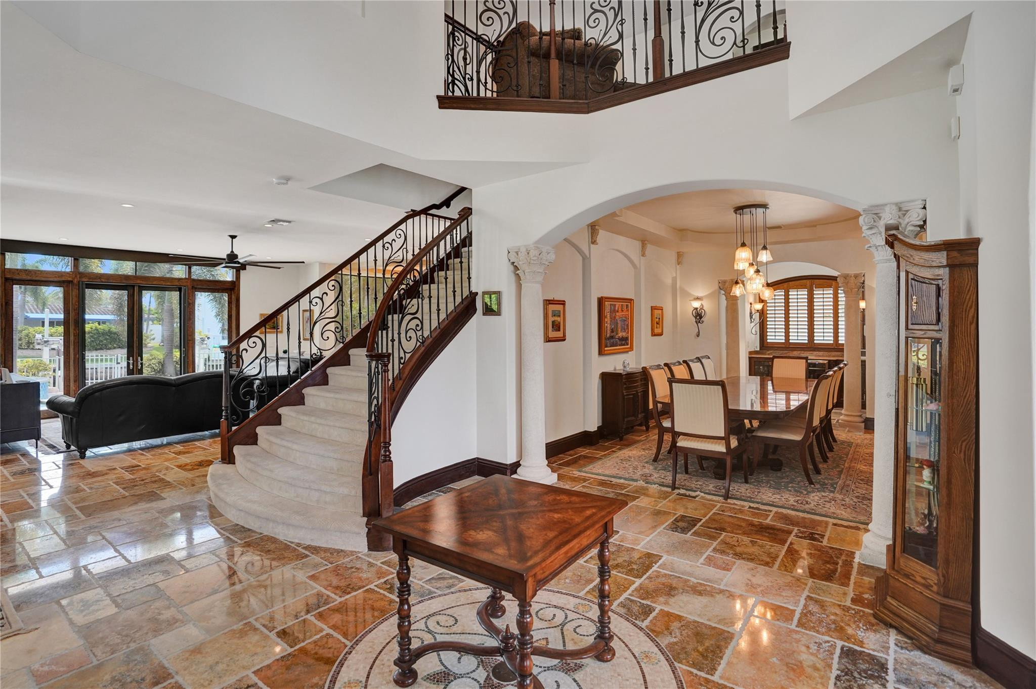 4930 Northeast 27th Terrace Lighthouse Point, FL 33064 - Photo 6 of 51 a living room with couches and dining table with rug