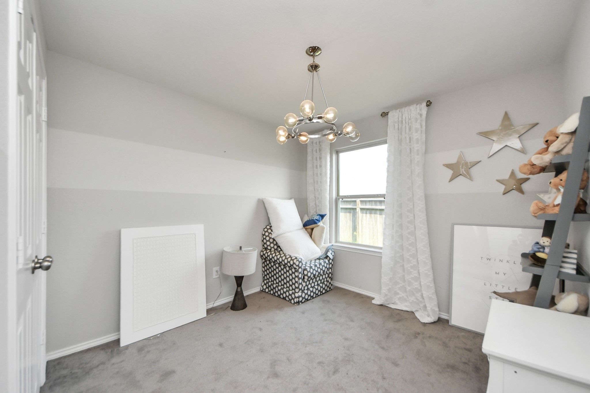 5735 Prairie Chapel Road Katy, TX 77493 - Photo 13 of 19 a living room with furniture and a chandelier