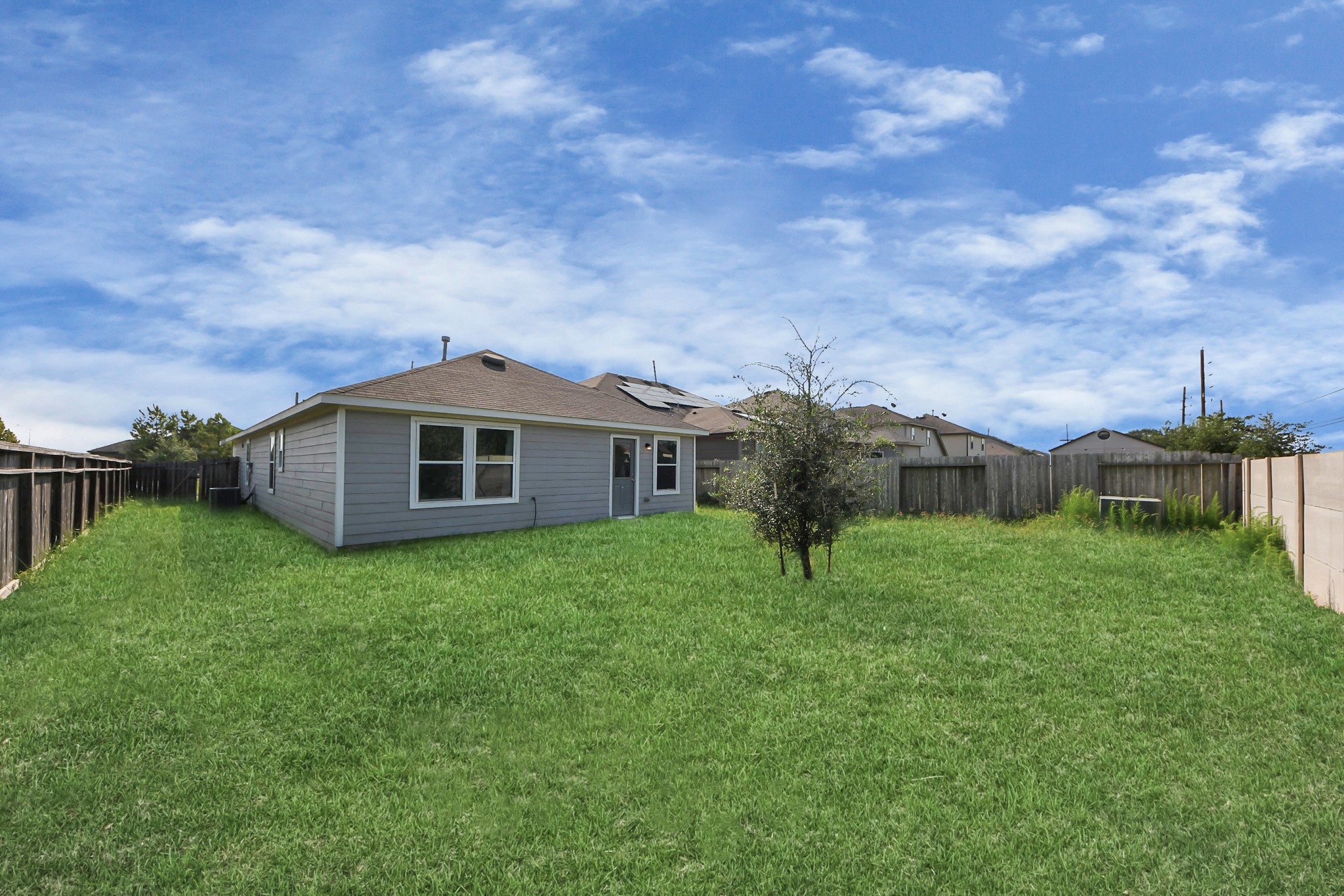 5735 Prairie Chapel Road Katy, TX 77493 - Photo 17 of 19 a front view of a house with garden