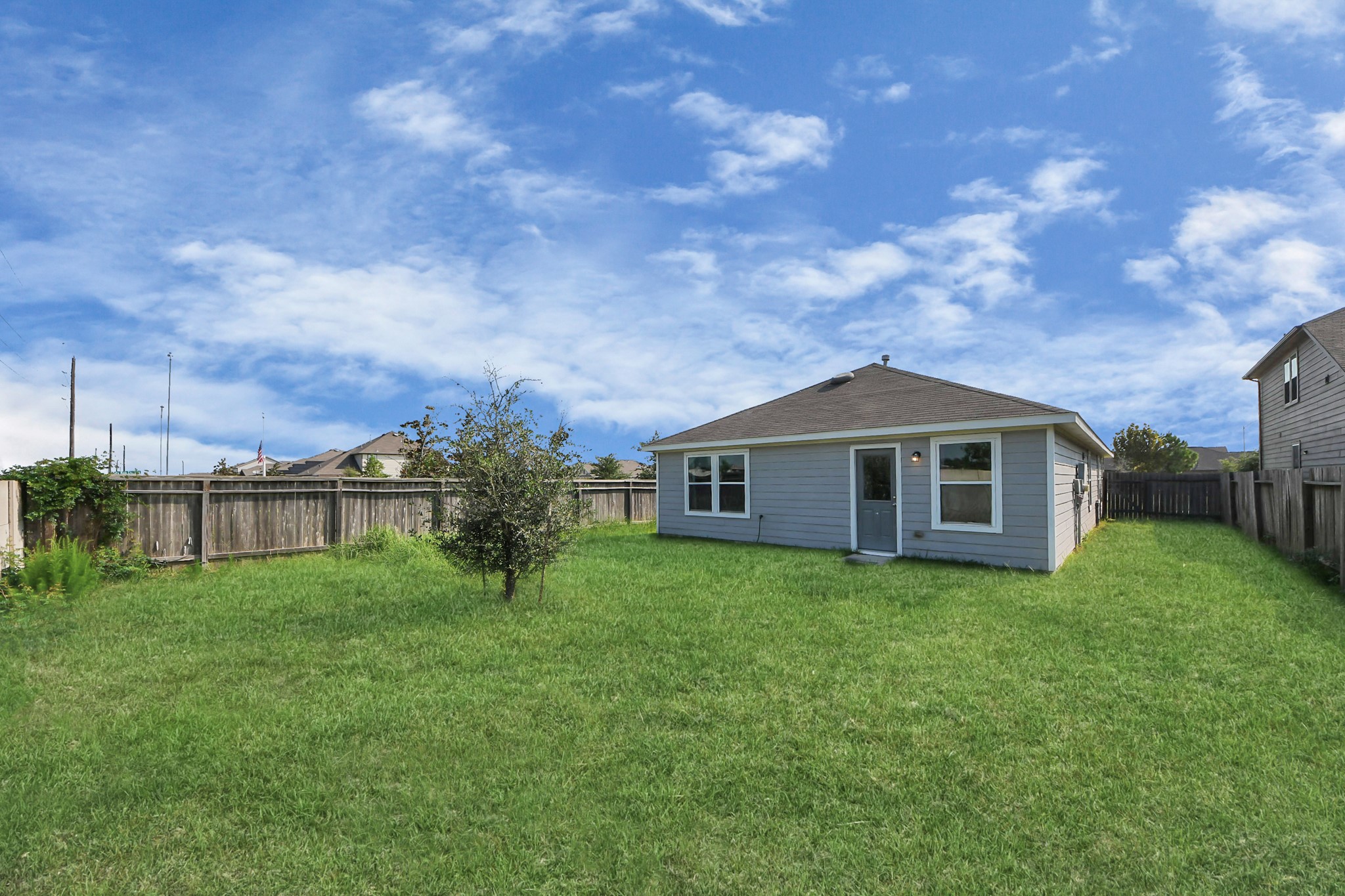 5735 Prairie Chapel Road Katy, TX 77493 - Photo 18 of 19 a view of a house with yard and a garden