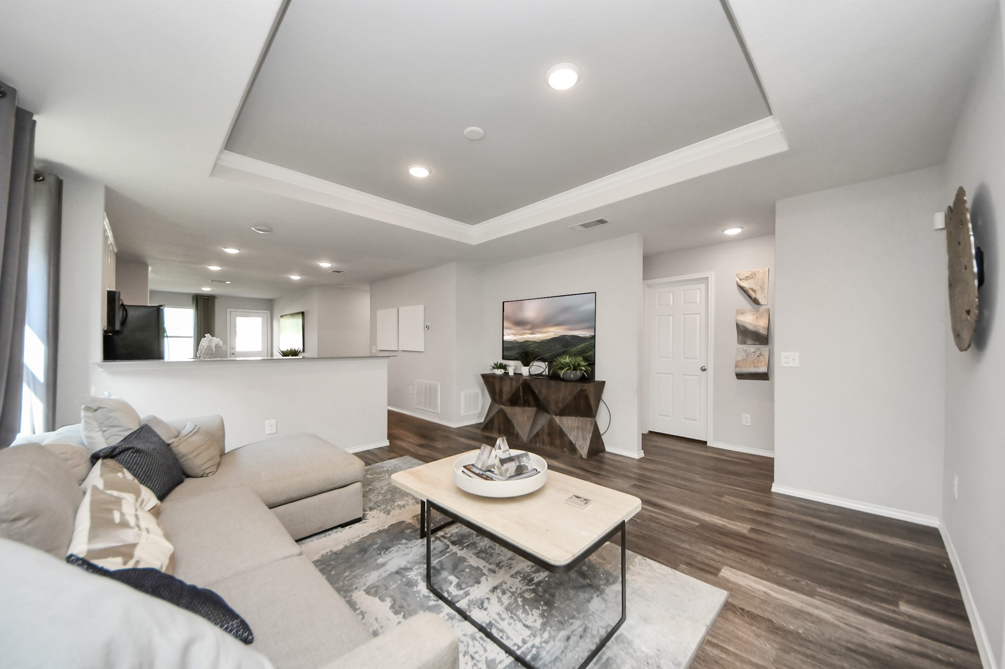5735 Prairie Chapel Road Katy, TX 77493 - Photo 8 of 19 a living room with furniture and a wooden floor