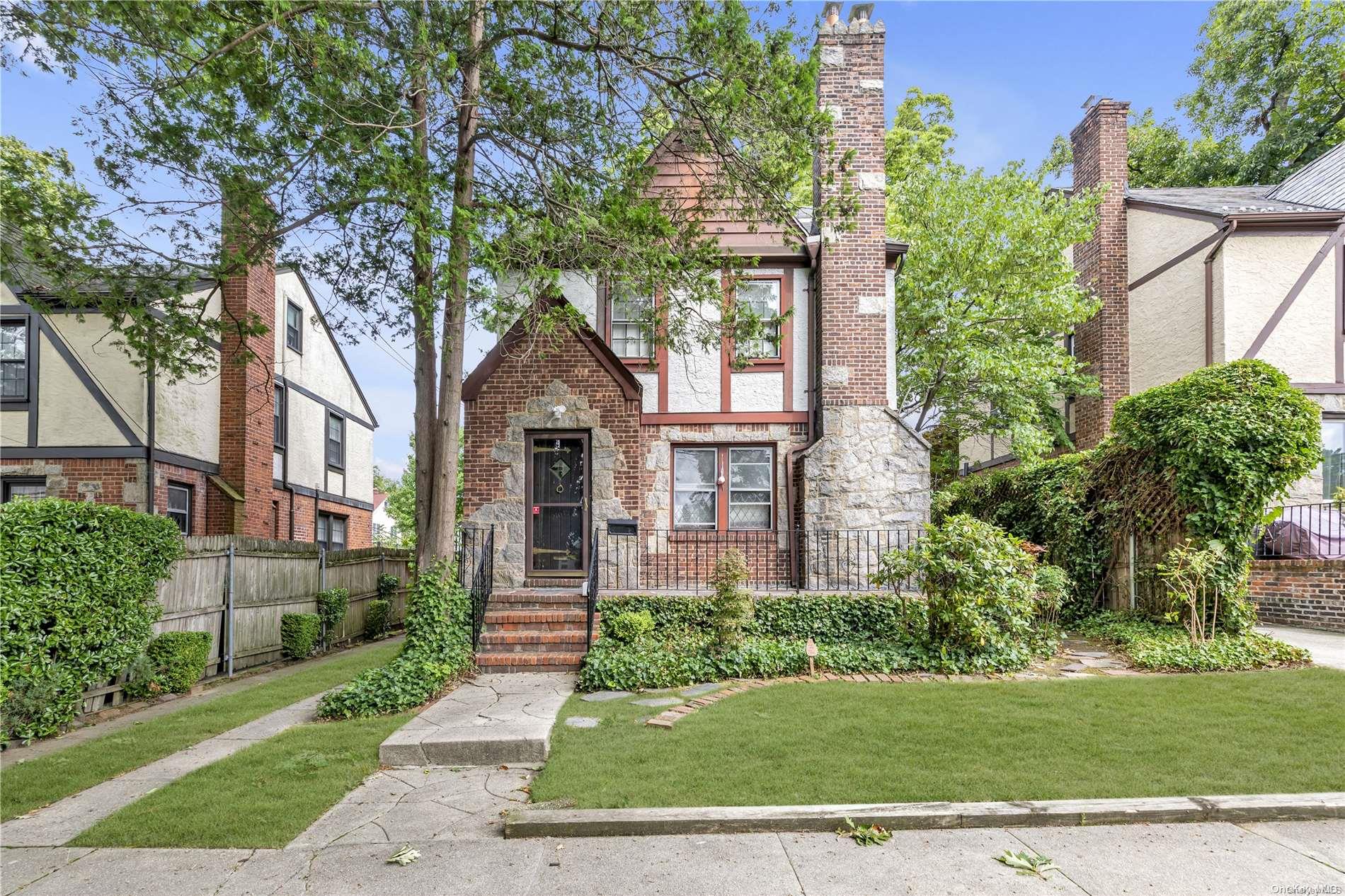 210-15 34th Road Queens, NY 11361 - Photo 1 of 1 a front view of a house with a yard