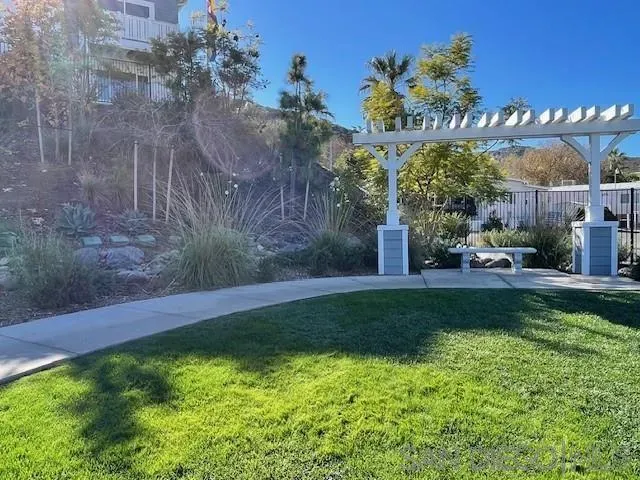 a kitchen with kitchen island sink stove and refrigerator