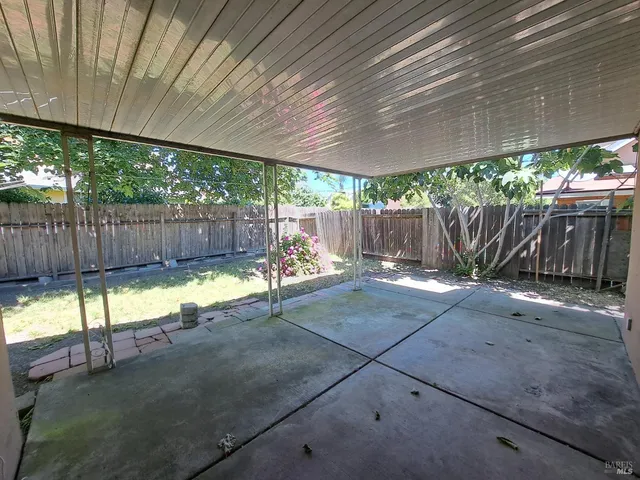 a view of a backyard with a small cabin