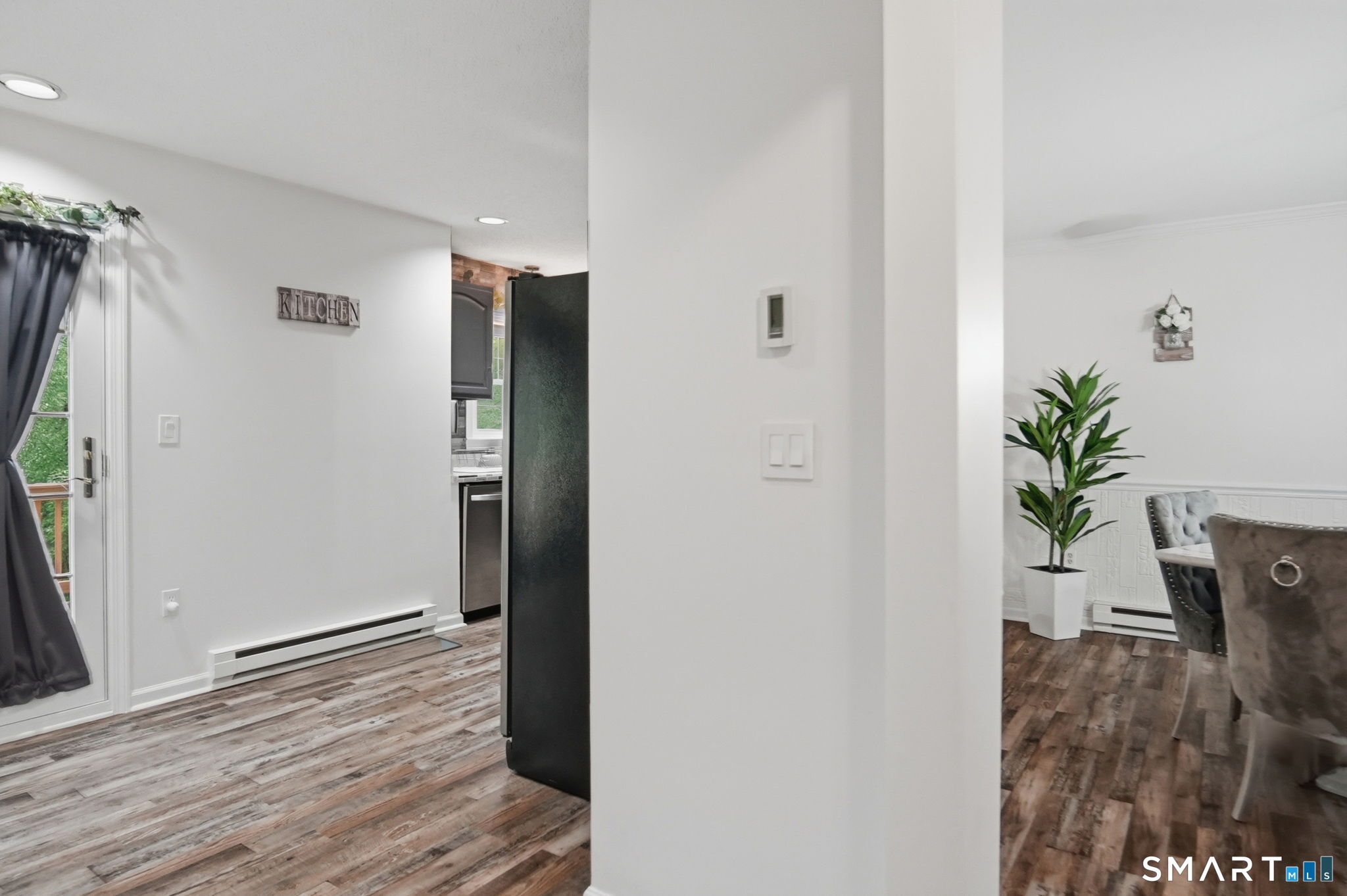 350 Bristol Street, Unit C12 Waterbury, CT 06708 - Photo 14 of 40 a view of livingroom with hardwood floor and hallway