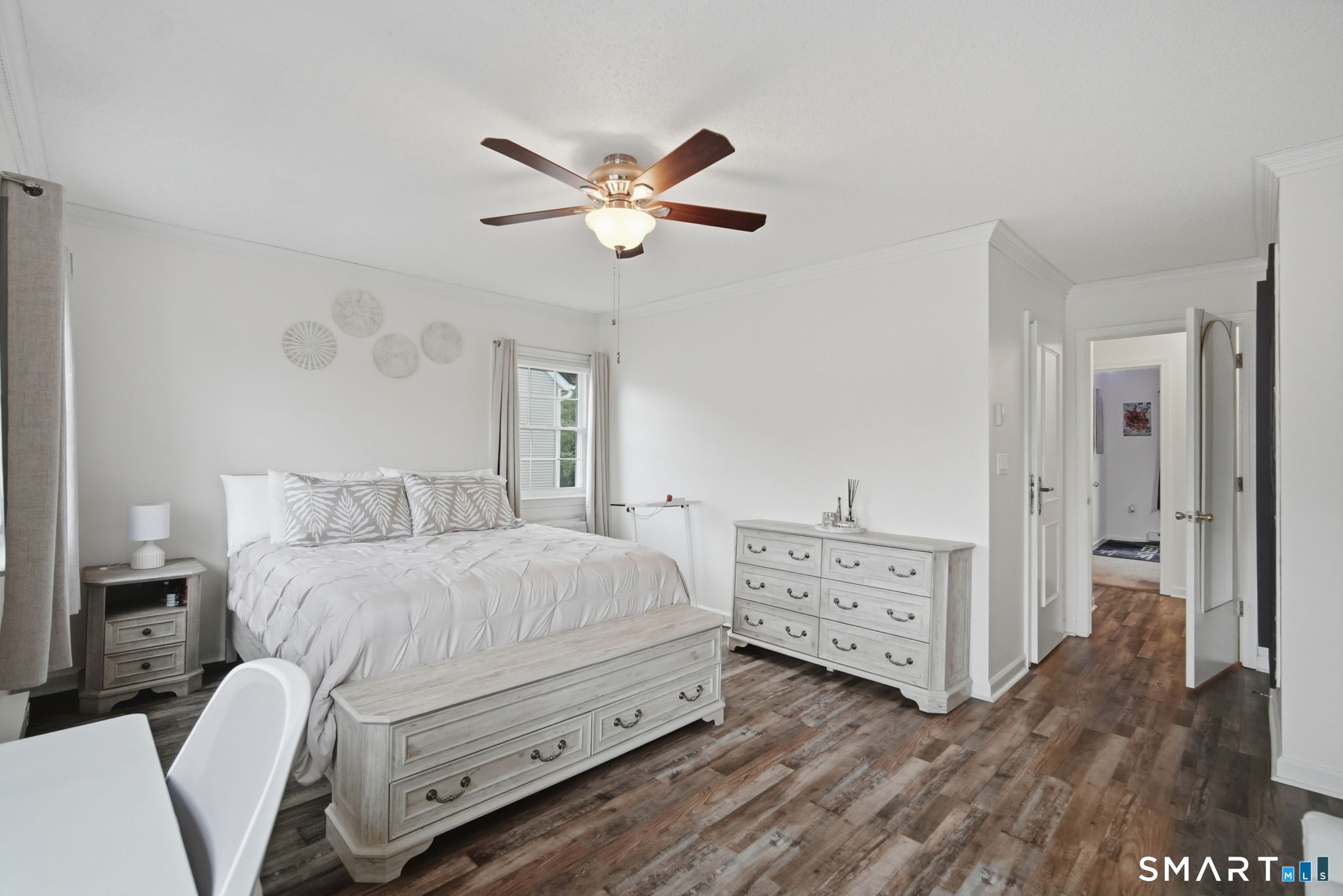 350 Bristol Street, Unit C12 Waterbury, CT 06708 - Photo 18 of 40 a bedroom with a bed and a chandelier