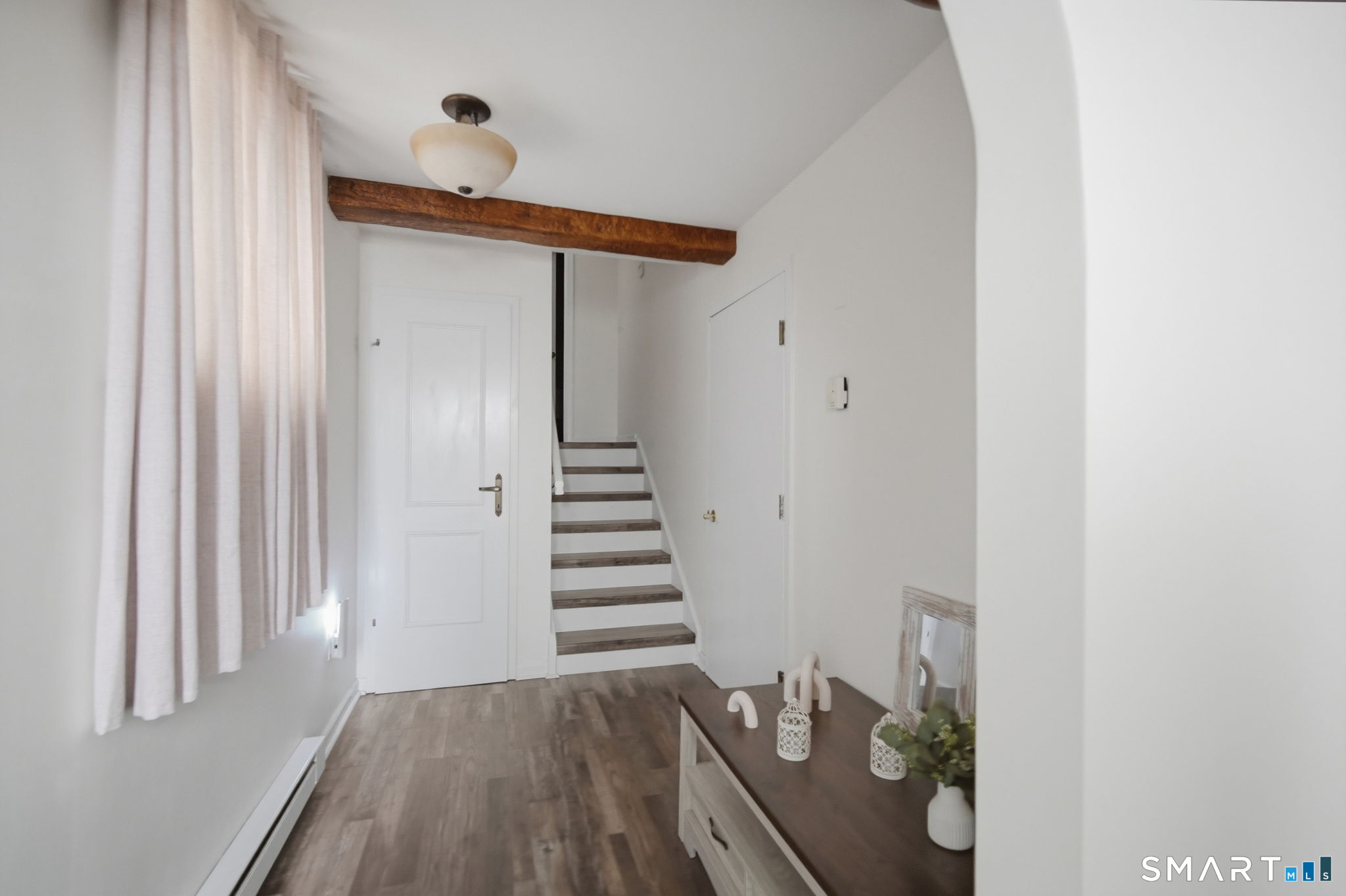 350 Bristol Street, Unit C12 Waterbury, CT 06708 - Photo 2 of 40 a view of a hallway with wooden floor and entryway