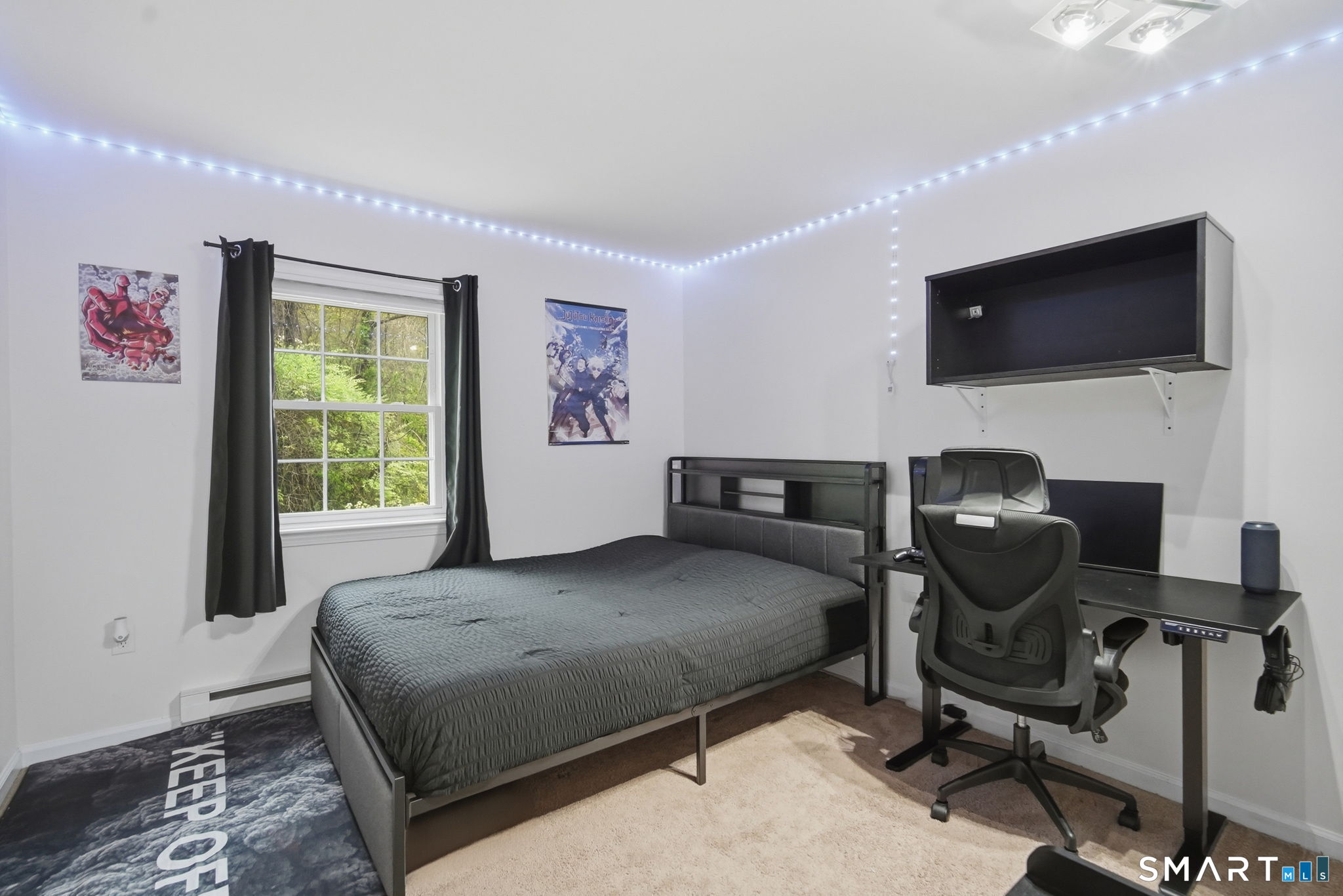 350 Bristol Street, Unit C12 Waterbury, CT 06708 - Photo 22 of 40 a bedroom with a bed tv and chair
