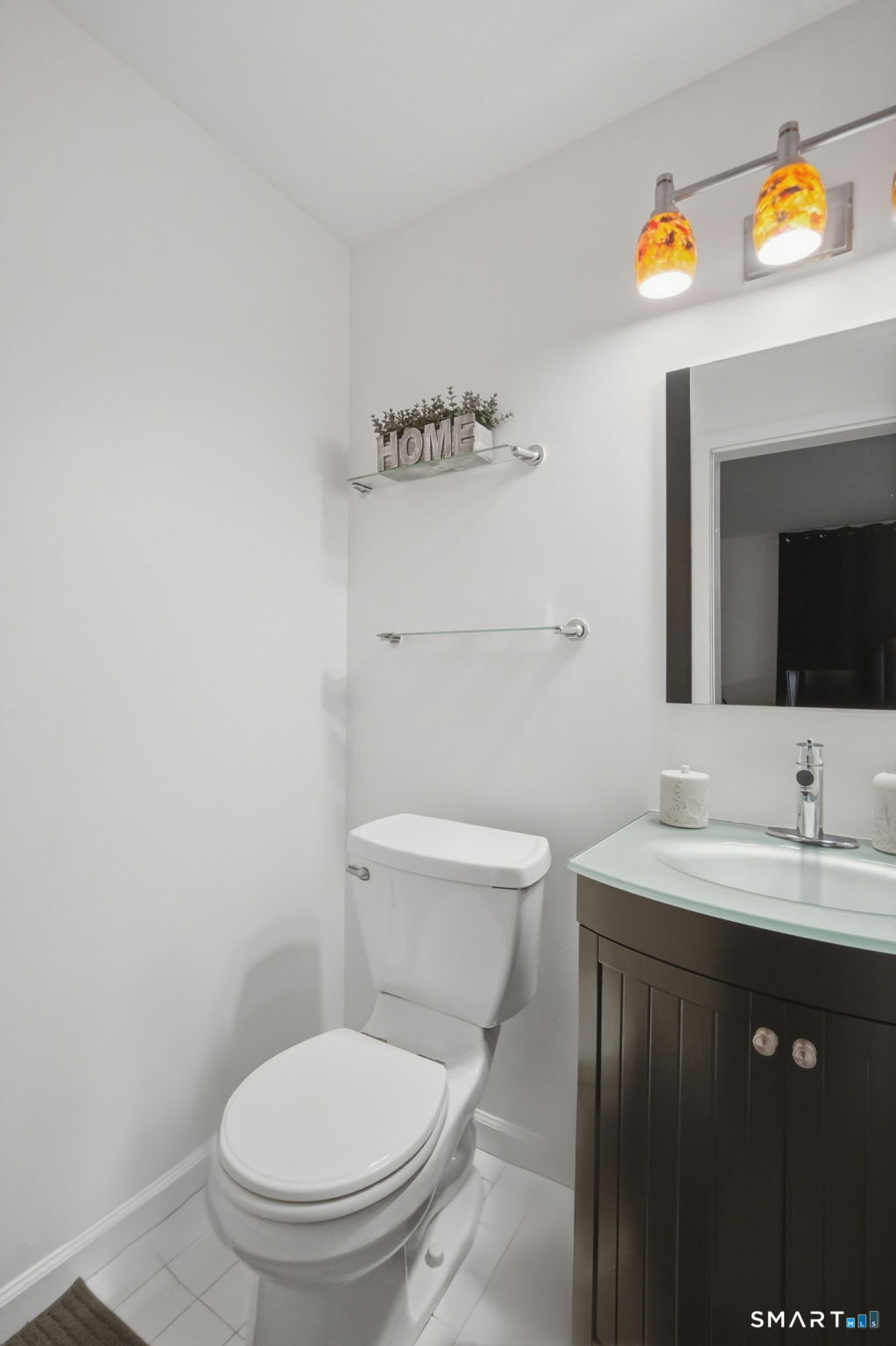 350 Bristol Street, Unit C12 Waterbury, CT 06708 - Photo 3 of 40 a bathroom with a toilet a sink and mirror