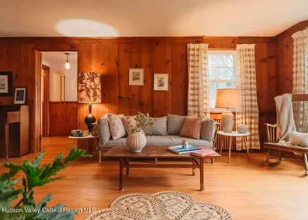 a bathroom with a sink mirror and a window