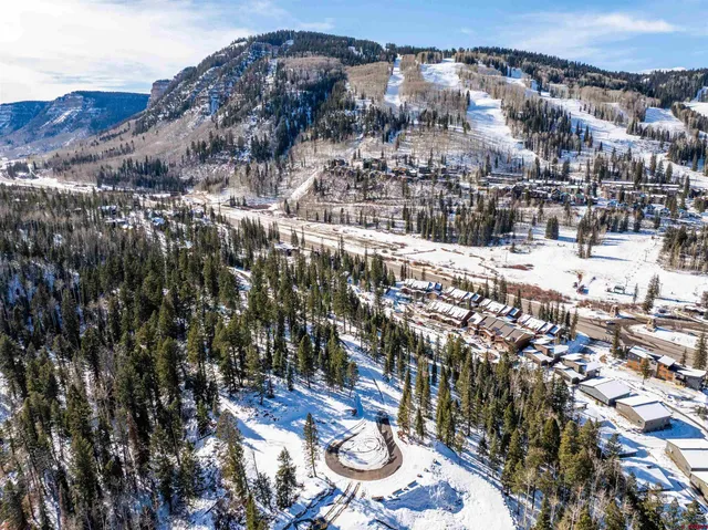 a view of a city with mountains in the background