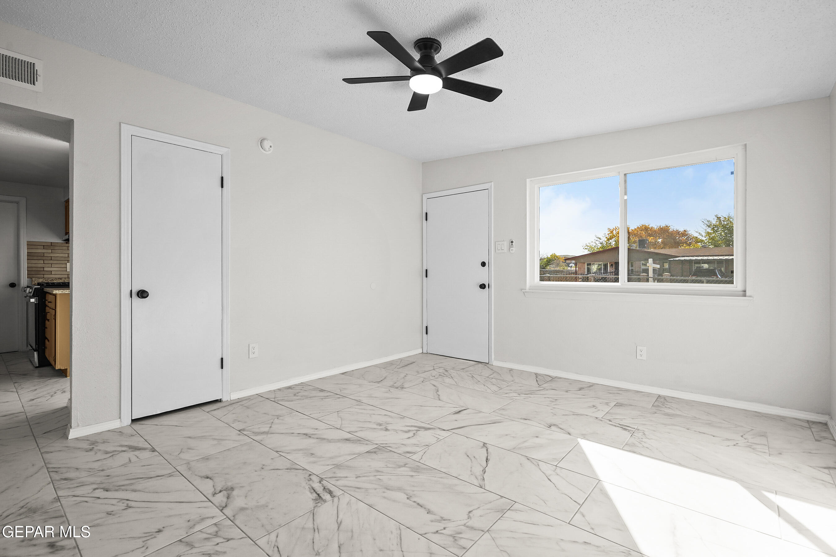 219 Caribe Circle El Paso, TX 79927 - Photo 12 of 43 a view of a livingroom with a ceiling fan and window