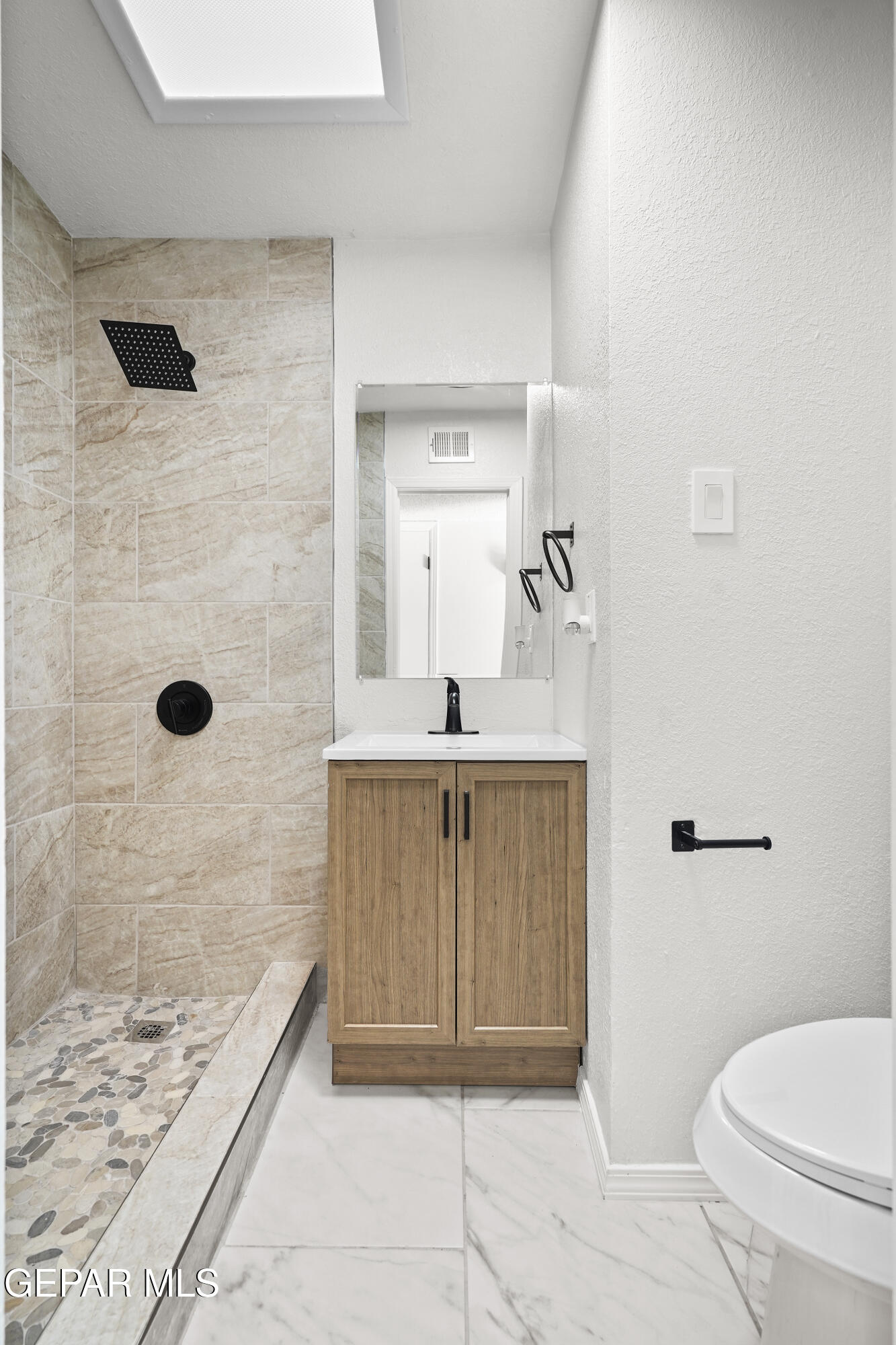 219 Caribe Circle El Paso, TX 79927 - Photo 24 of 43 a bathroom with a sink a toilet a mirror and shower