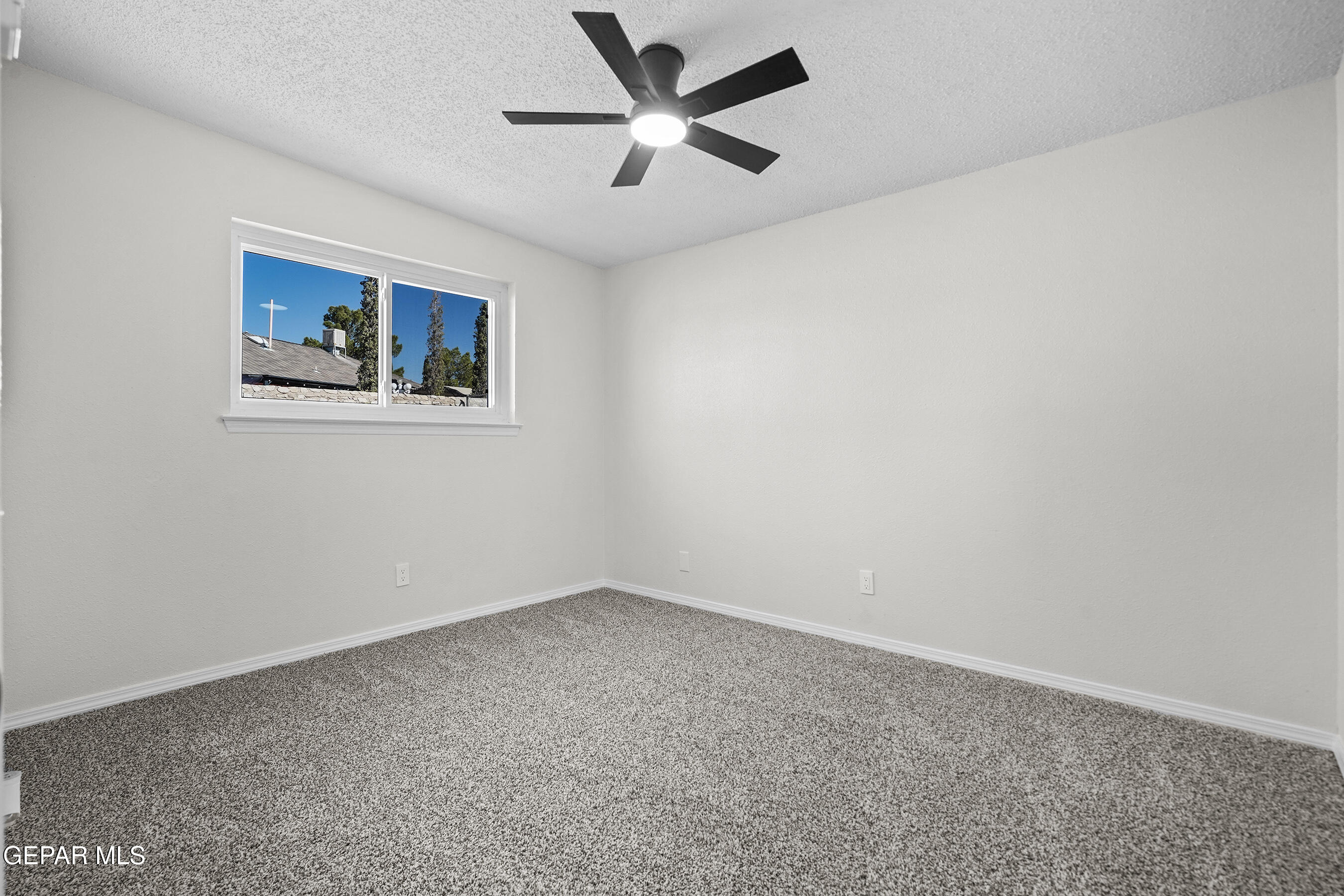 219 Caribe Circle El Paso, TX 79927 - Photo 30 of 43 an empty room with a window and a fan