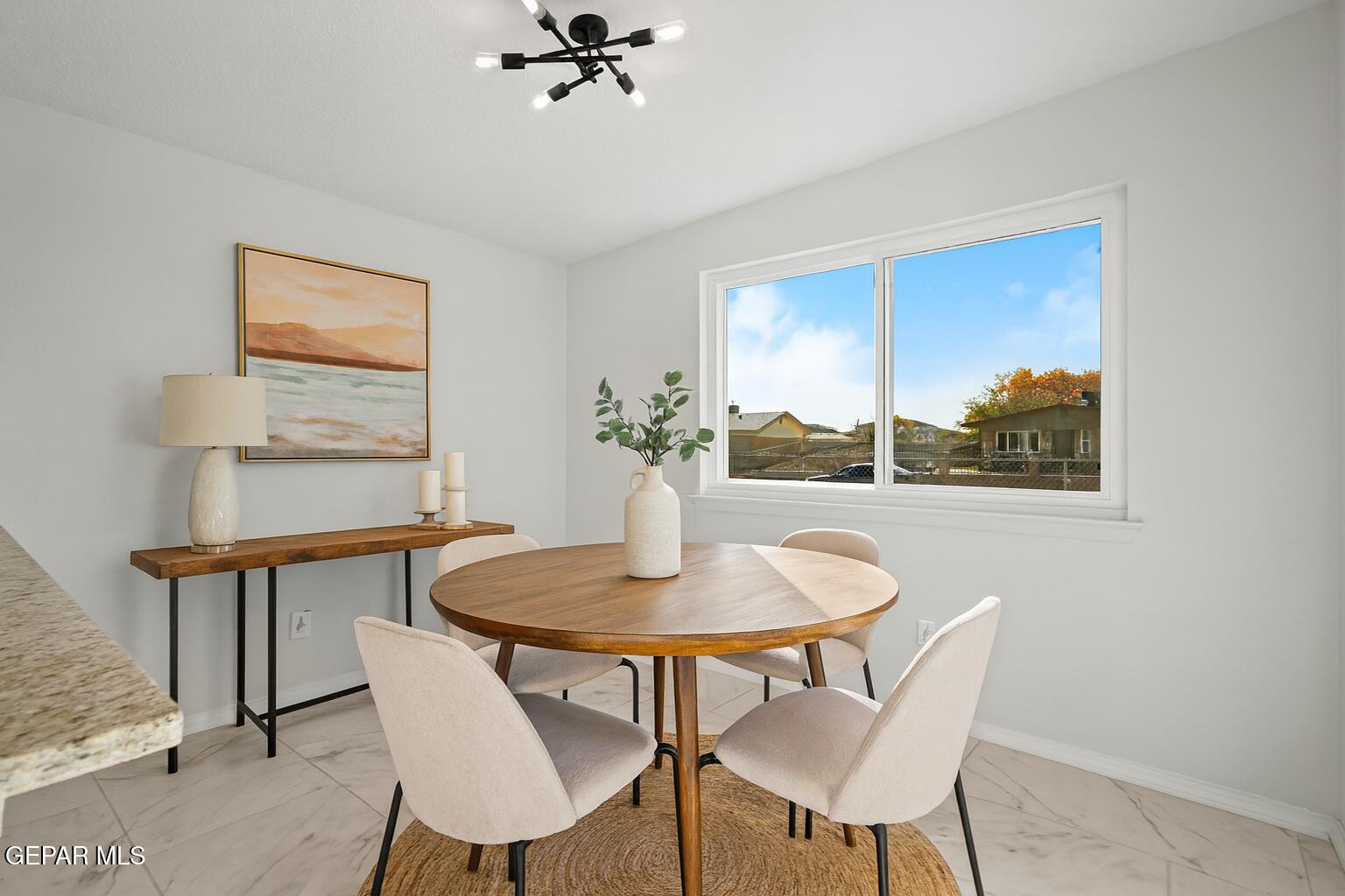 219 Caribe Circle El Paso, TX 79927 - Photo 4 of 43 a view of a dining room with furniture and a potted plant