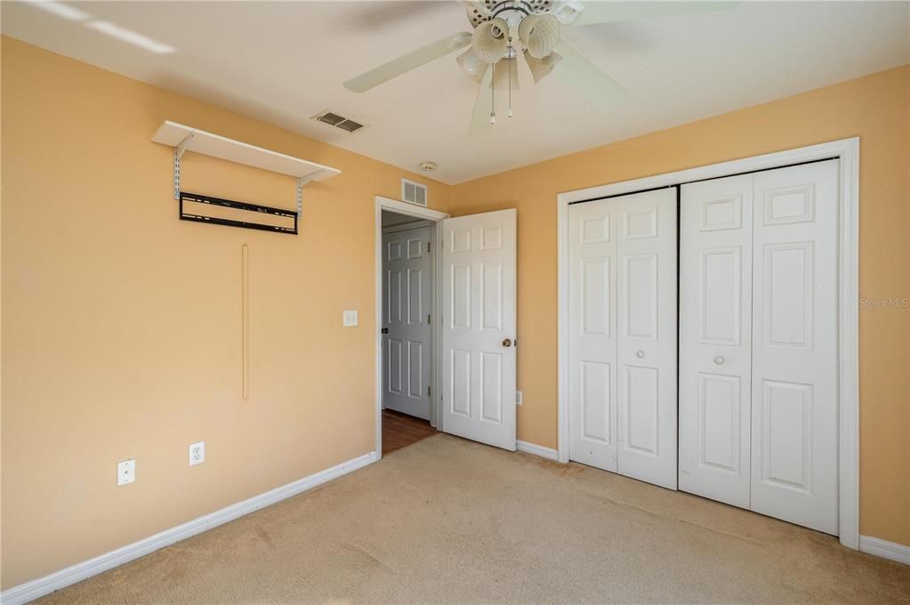 403 Southeast 3rd Street Fort Meade, FL 33841 - Photo 17 of 30 a view of a hallway with a chandelier