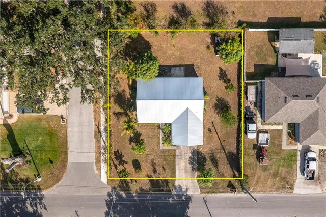 an aerial view of a house with outdoor space