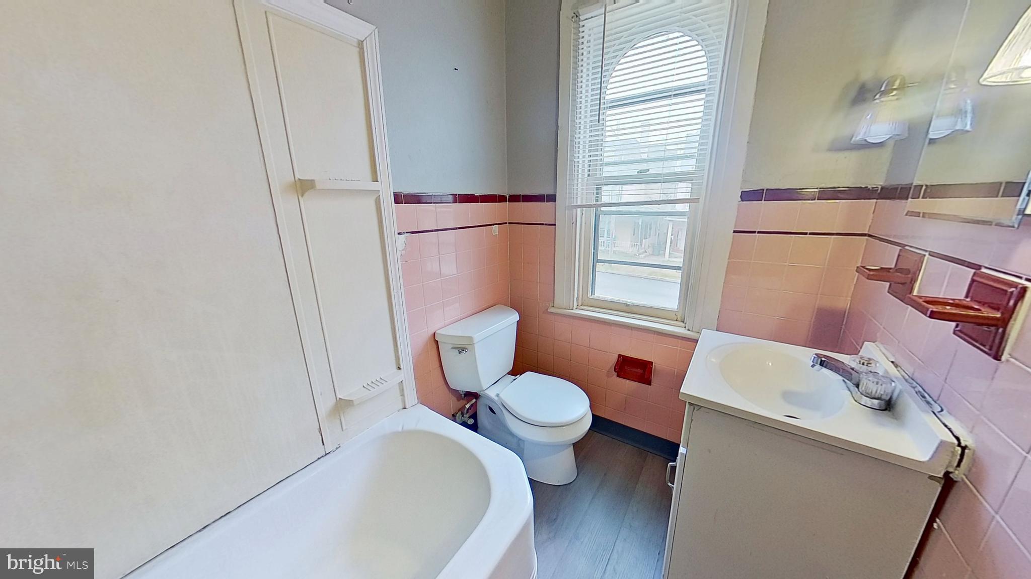334 North Beaver Street York, PA 17401 - Photo 8 of 8 a bathroom with a sink a toilet and tub