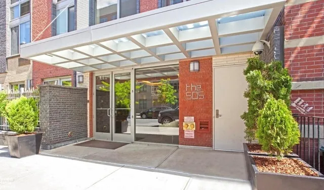 a bathroom with a sink mirror and a shower