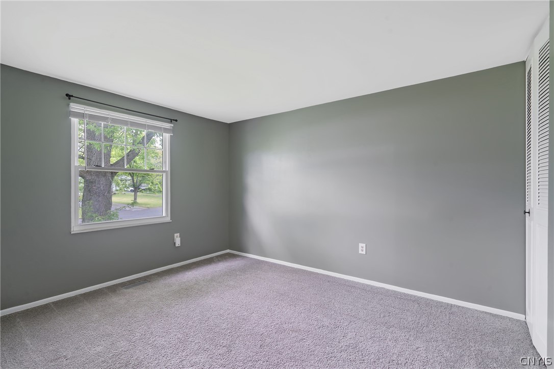 114 Saltwell Road Salina, NY 13090 - Photo 18 of 27 Bedroom two is a larger option with a window overlooking the adorable suburban street at the front yard.