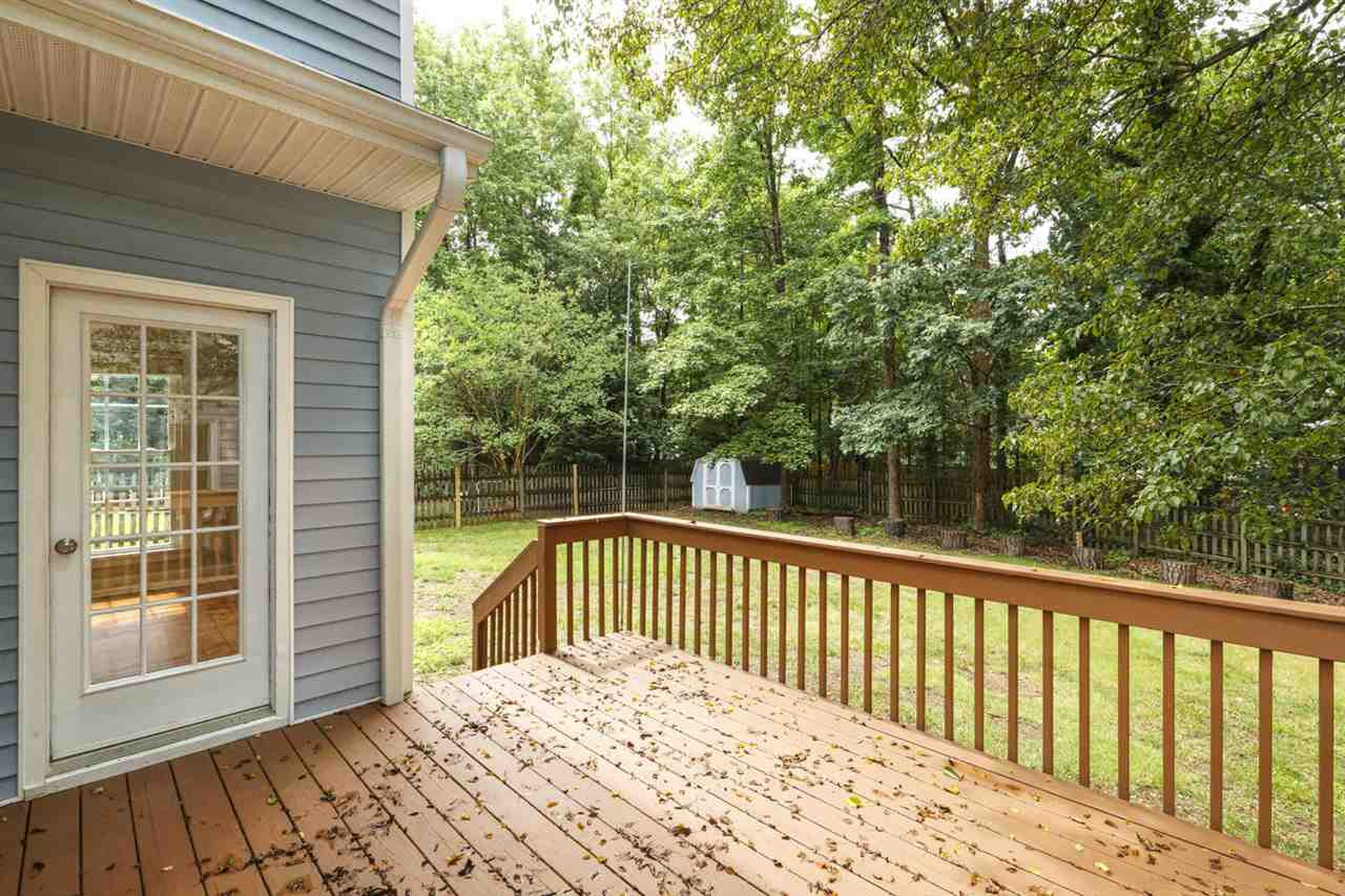 5205 Covington Bend Drive Raleigh, NC 27613 - Photo 9 of 16 The deck overlooks the private/FENCED yard. There's a storage shed too for all you extra storage needs. One of the best lots in the neighborhood - this home backs up to a tree preservation area! Deck