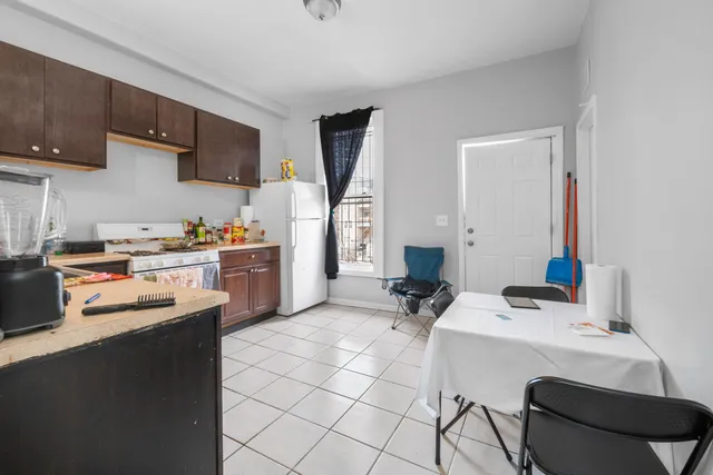 a kitchen with a sink a stove and a cabinets