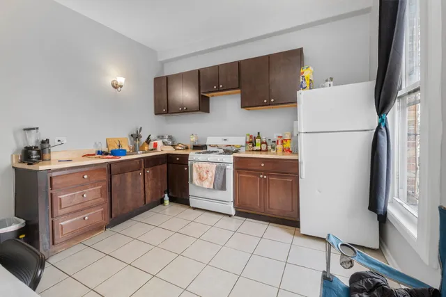a kitchen with a sink appliances and cabinets