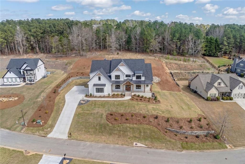 2661 Alexis Way Monroe, GA 30656 - Photo 5 of 12 a view of a swimming pool with a yard