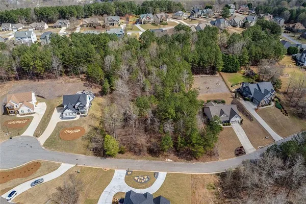 an aerial view of a house with swimming pool