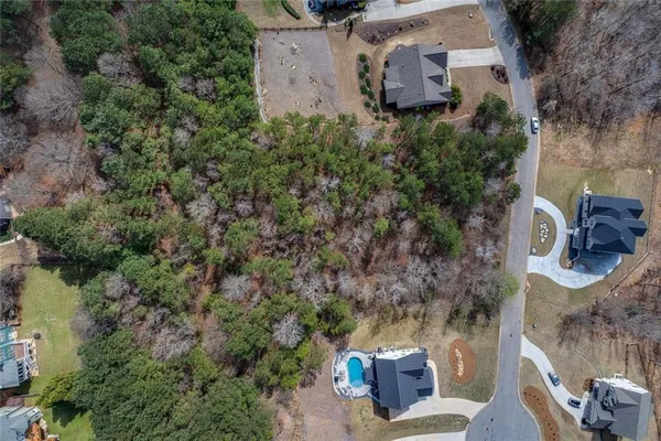 an aerial view of a house with outdoor space and sitting space