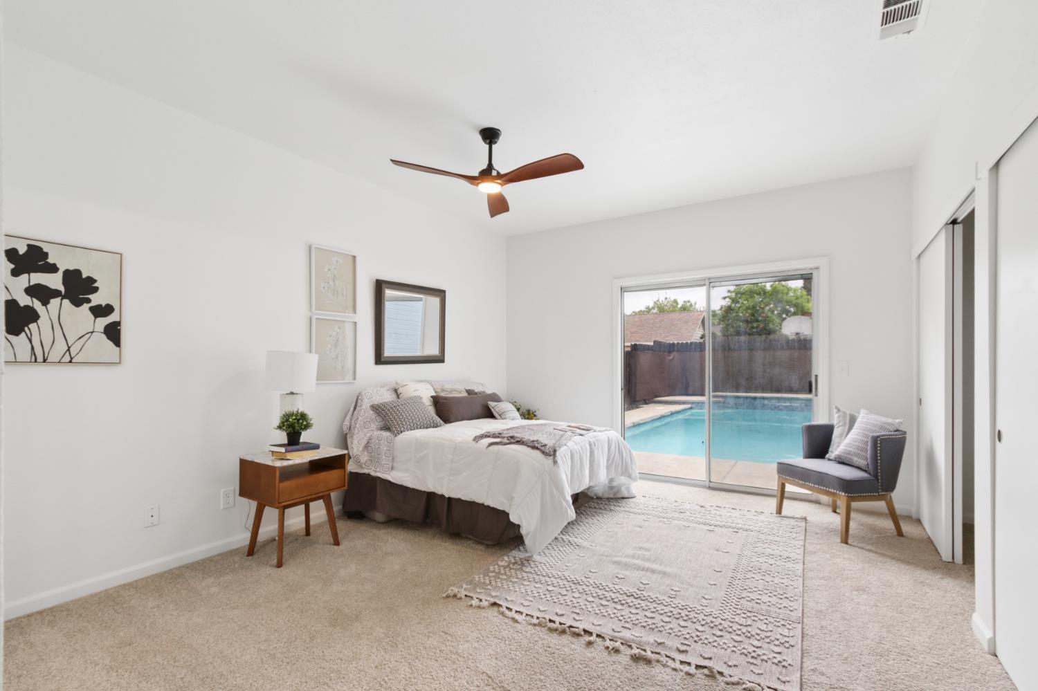 225 Creekside Way Winters, CA 95694 - Photo 18 of 56 a bedroom with furniture and a chair