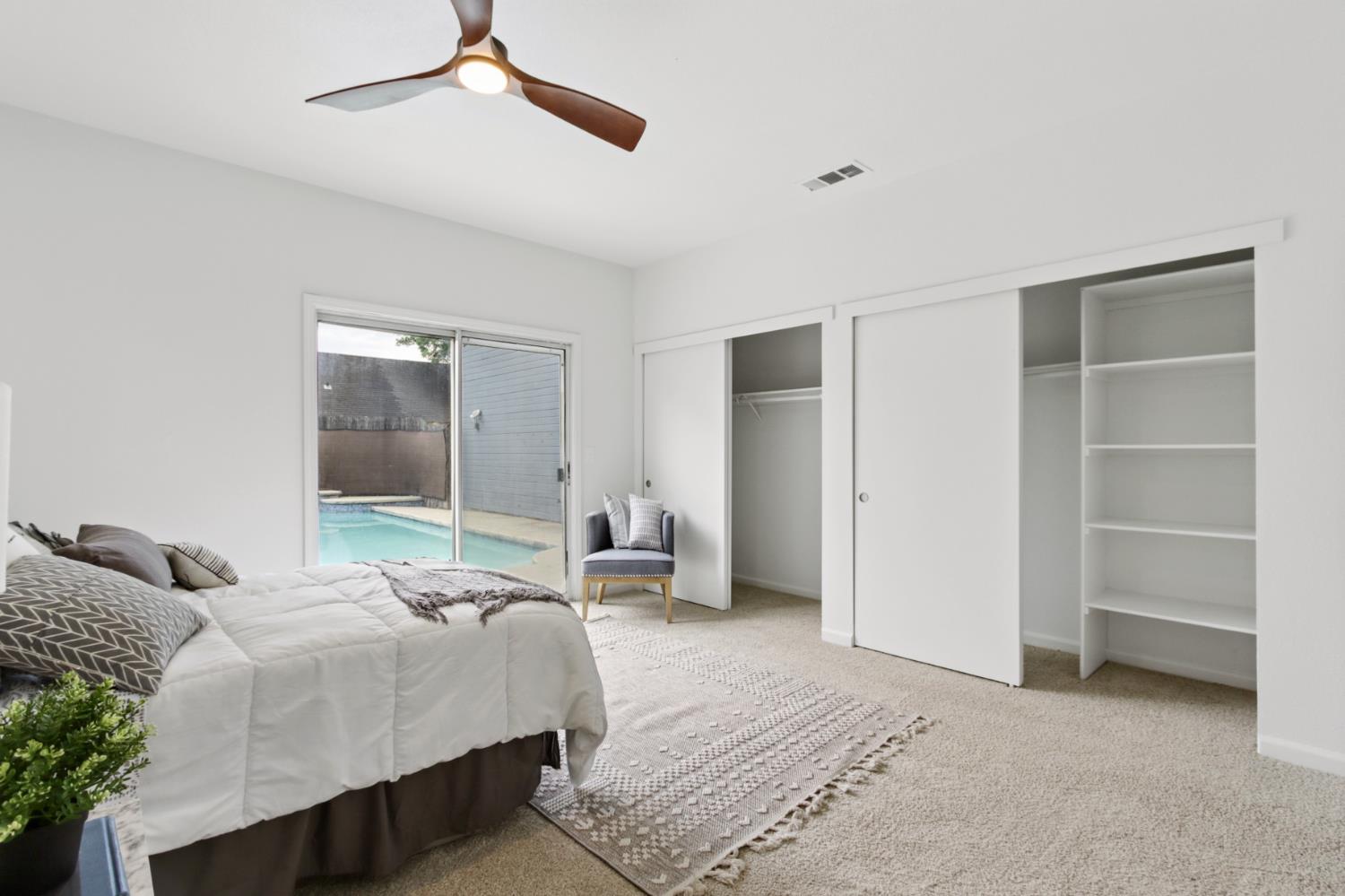 225 Creekside Way Winters, CA 95694 - Photo 20 of 56 a bedroom with a bed and a walk in closet