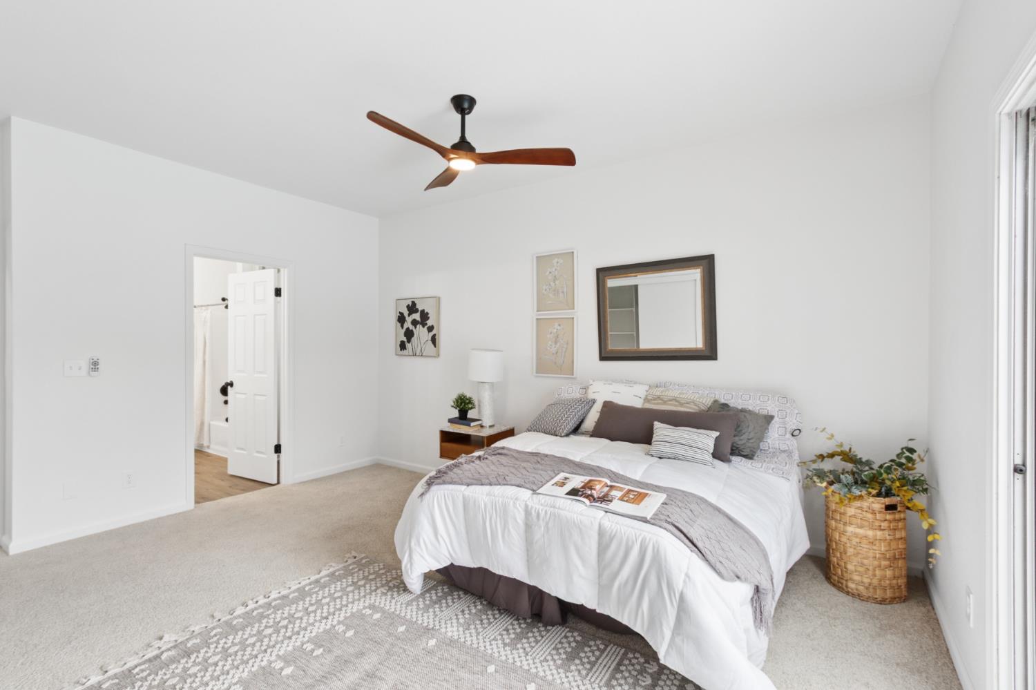 225 Creekside Way Winters, CA 95694 - Photo 21 of 56 a bedroom with a large bed and a ceiling fan