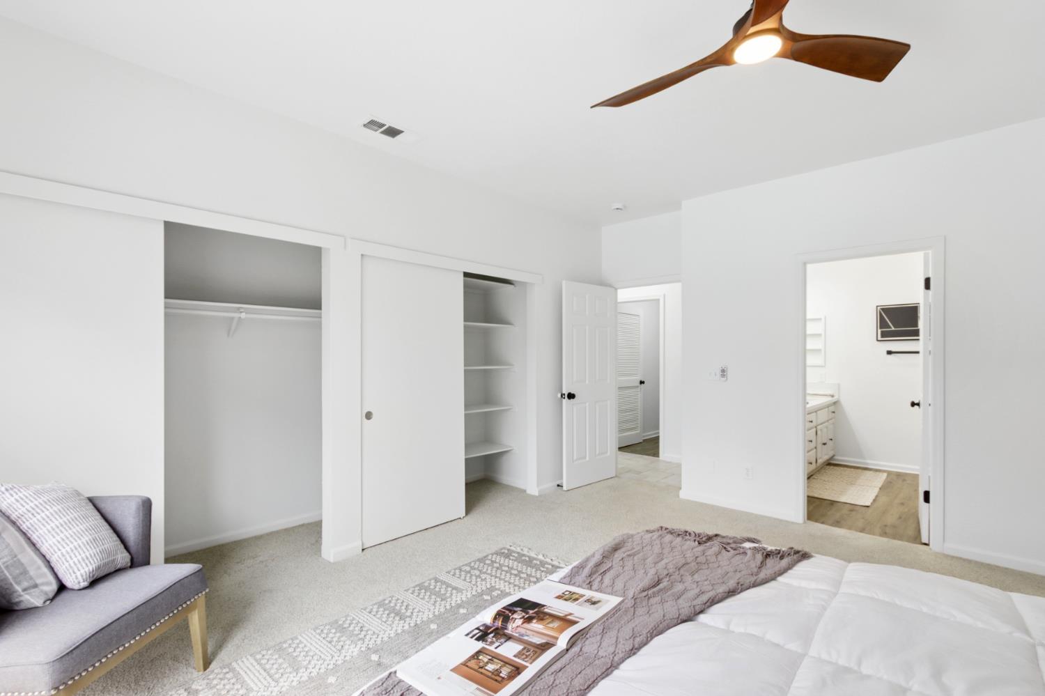 225 Creekside Way Winters, CA 95694 - Photo 22 of 56 a bedroom with a bed and a couch