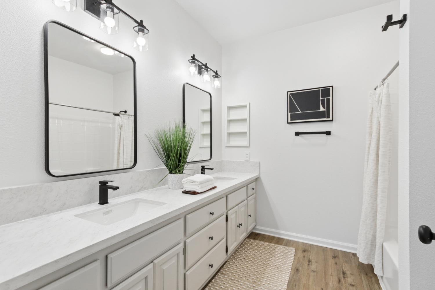 225 Creekside Way Winters, CA 95694 - Photo 23 of 56 a bathroom with 2 sink and a mirror
