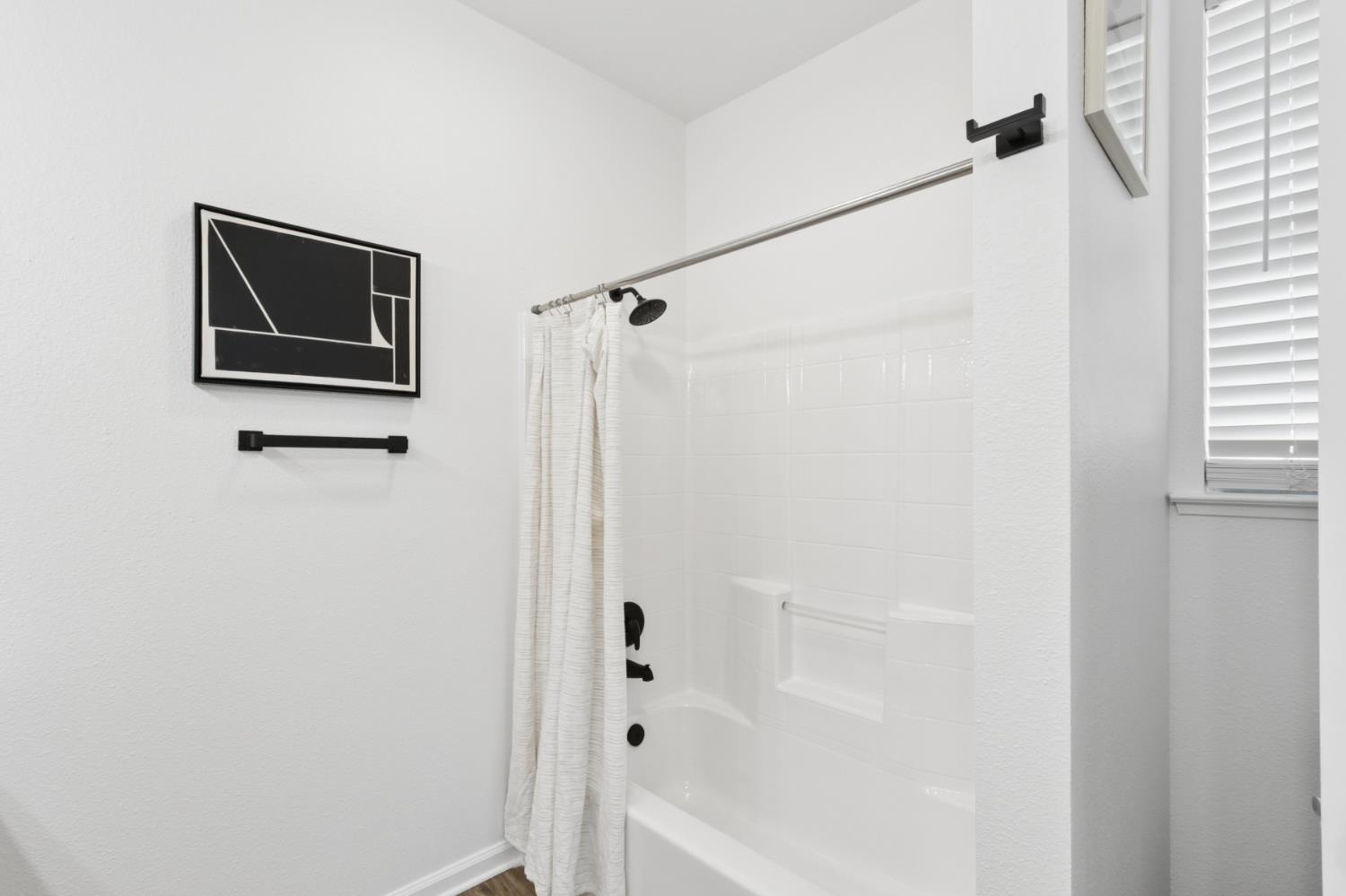 225 Creekside Way Winters, CA 95694 - Photo 24 of 56 a bathroom with a shower and a window
