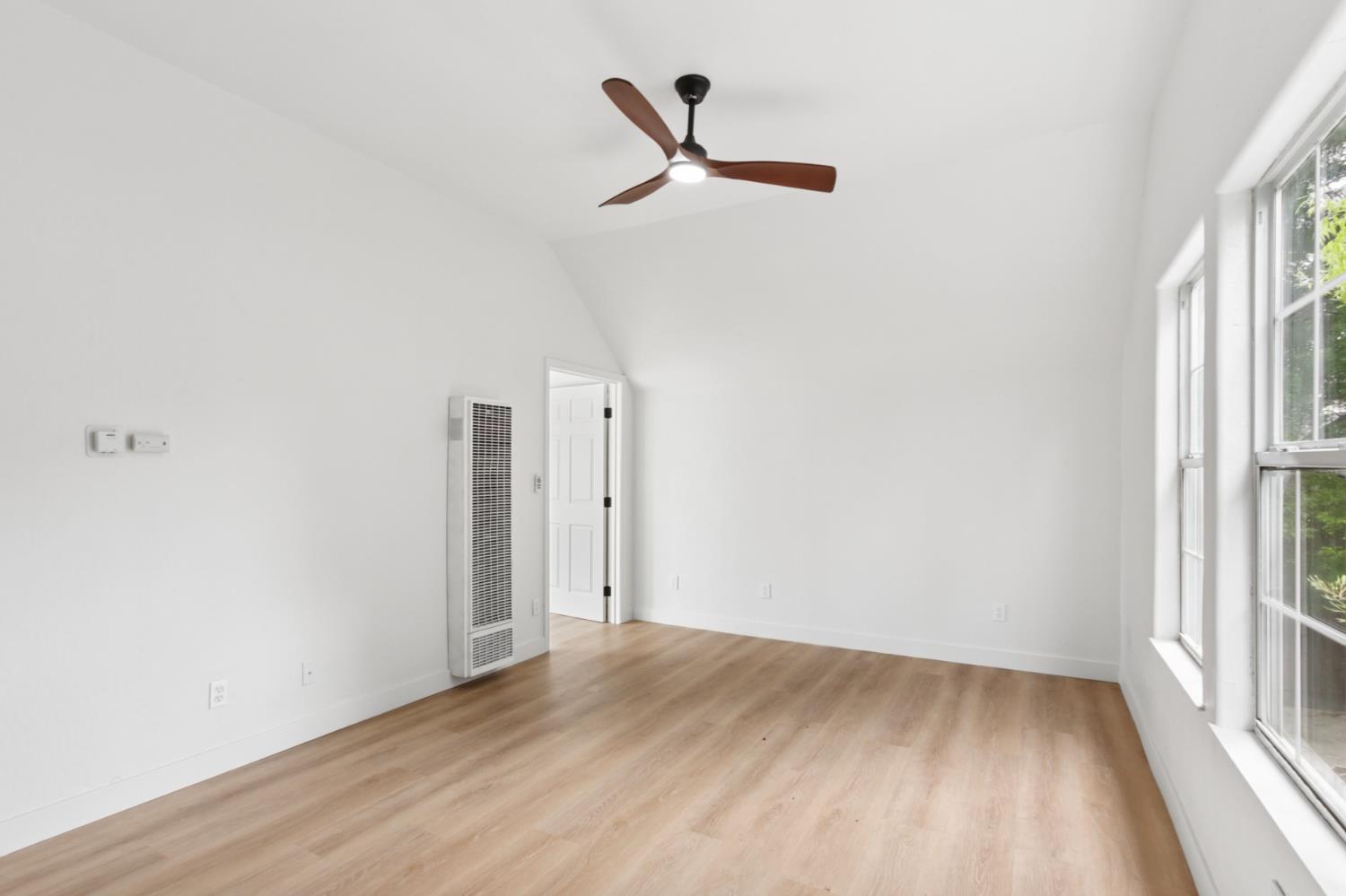 225 Creekside Way Winters, CA 95694 - Photo 31 of 56 a view of a room with wooden floor ceiling fan