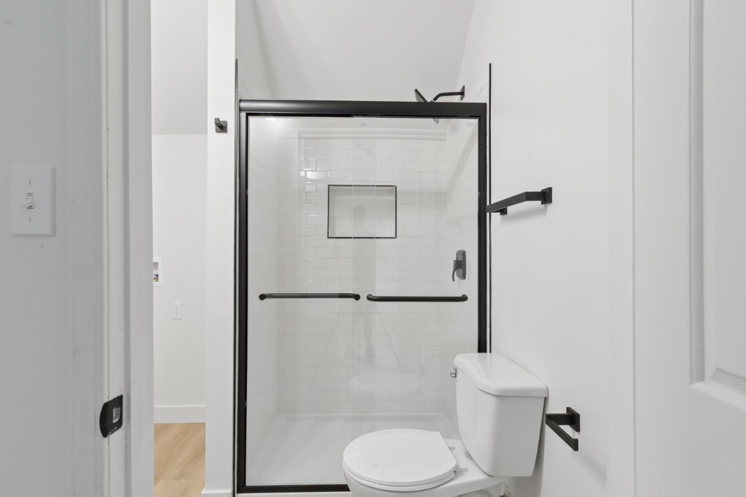225 Creekside Way Winters, CA 95694 - Photo 34 of 56 a white toilet sitting next to a bathroom sink