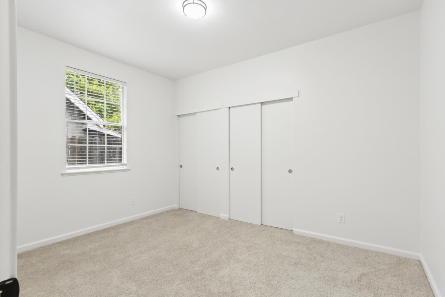 225 Creekside Way Winters, CA 95694 - Photo 38 of 56 an empty room with windows