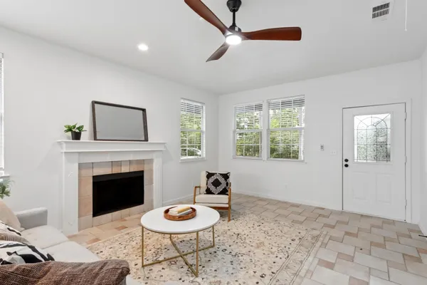 a living room with furniture and a fireplace