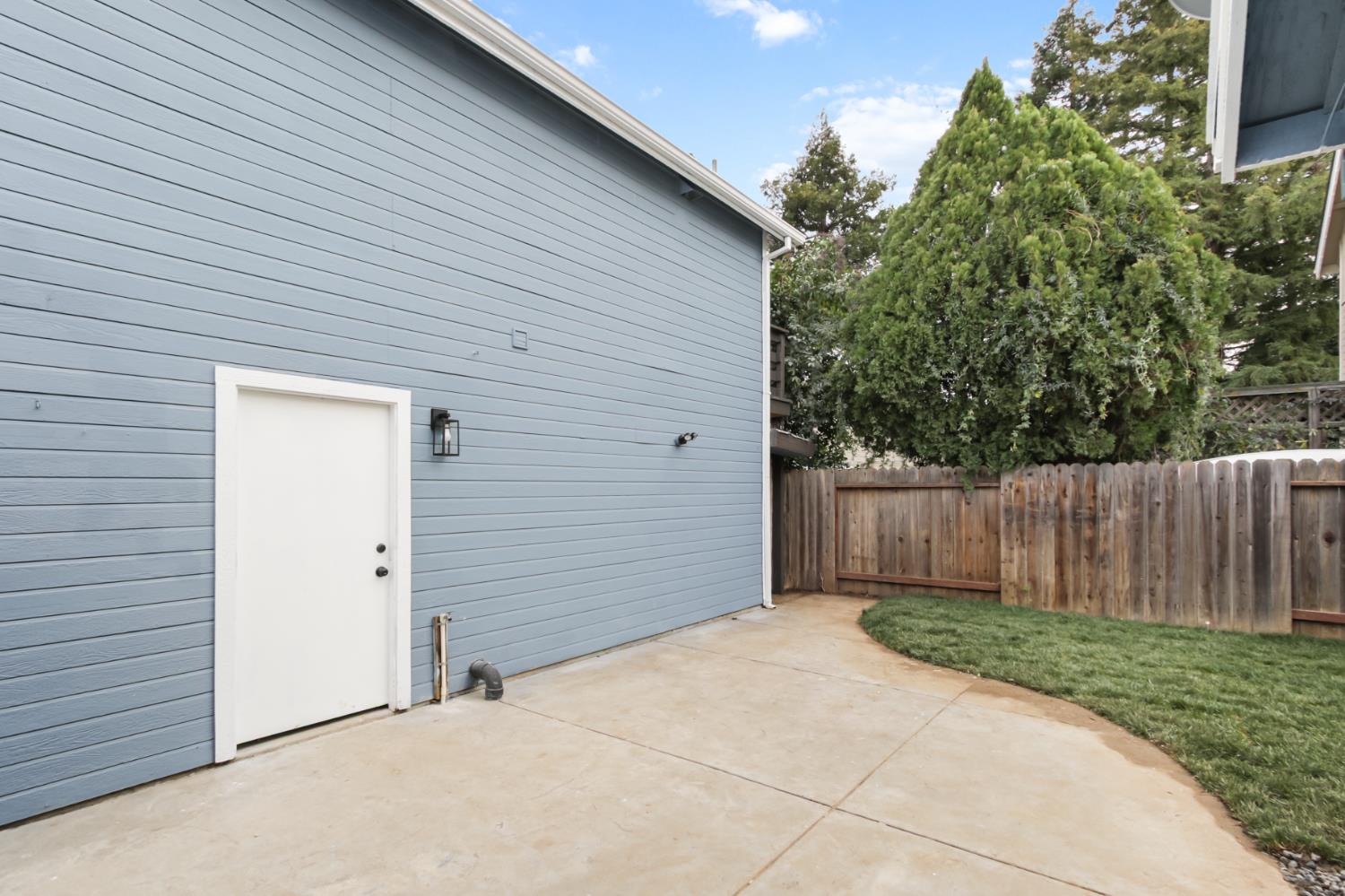 225 Creekside Way Winters, CA 95694 - Photo 49 of 56 a view of backyard with small cabin and wooden fence