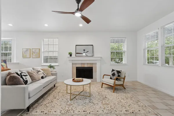 a living room with furniture and a fireplace