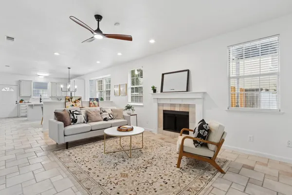 a living room with furniture and a fireplace