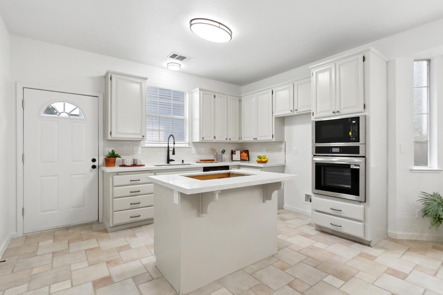 225 Creekside Way Winters, CA 95694 - Photo 10 of 56 a kitchen with stainless steel appliances a stove sink and microwave