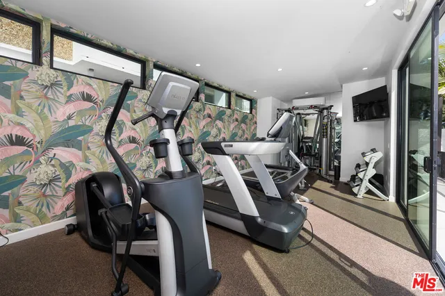 a lobby with furniture and a mirror