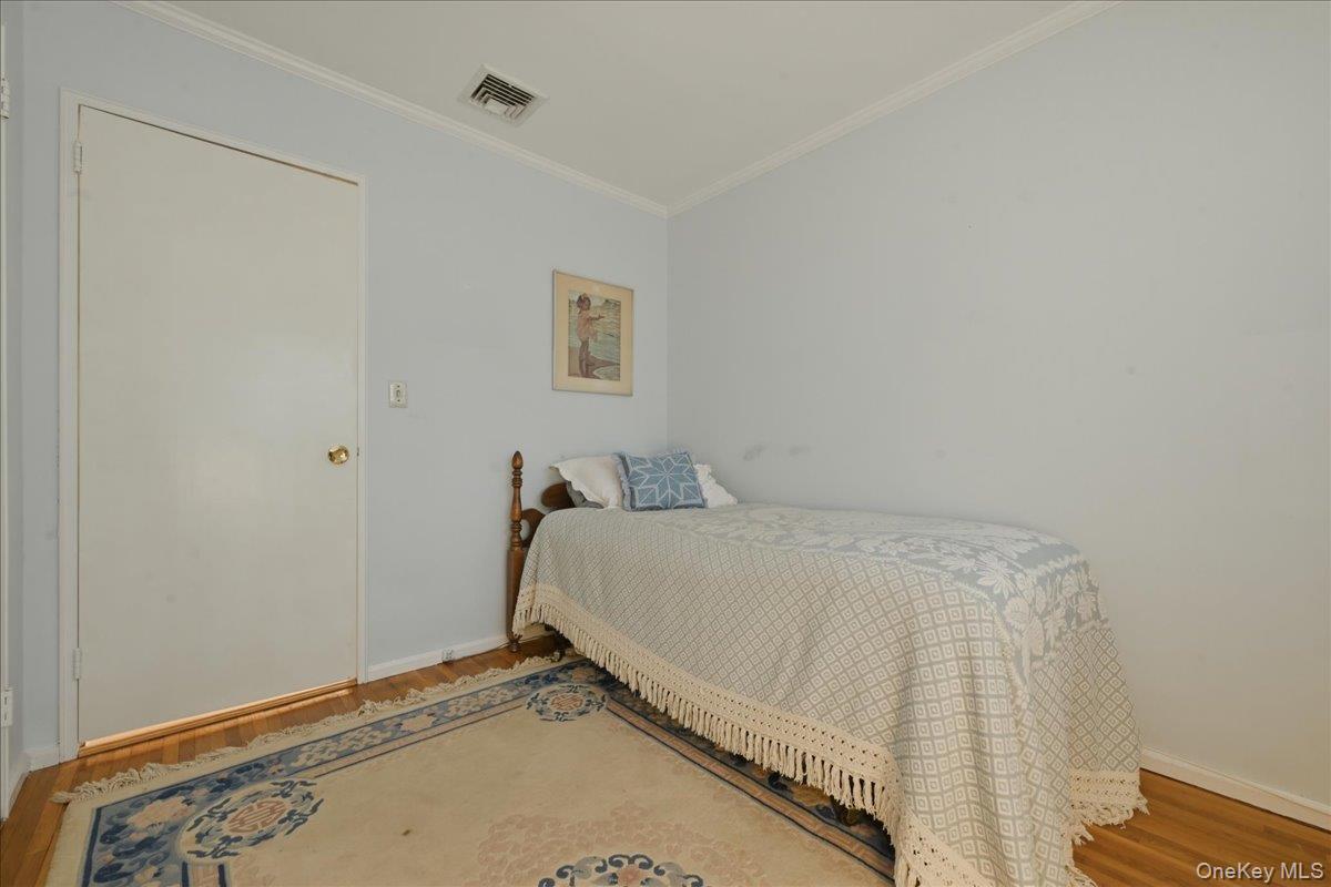 17 Avon Road Farmingdale, NY 11735 - Photo 21 of 46 a bedroom with a bed and a window